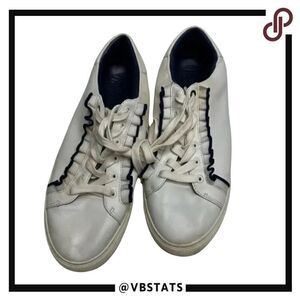 Tory Burch Ruffle sneakers. Size 10M. White with elegant black ruffle.